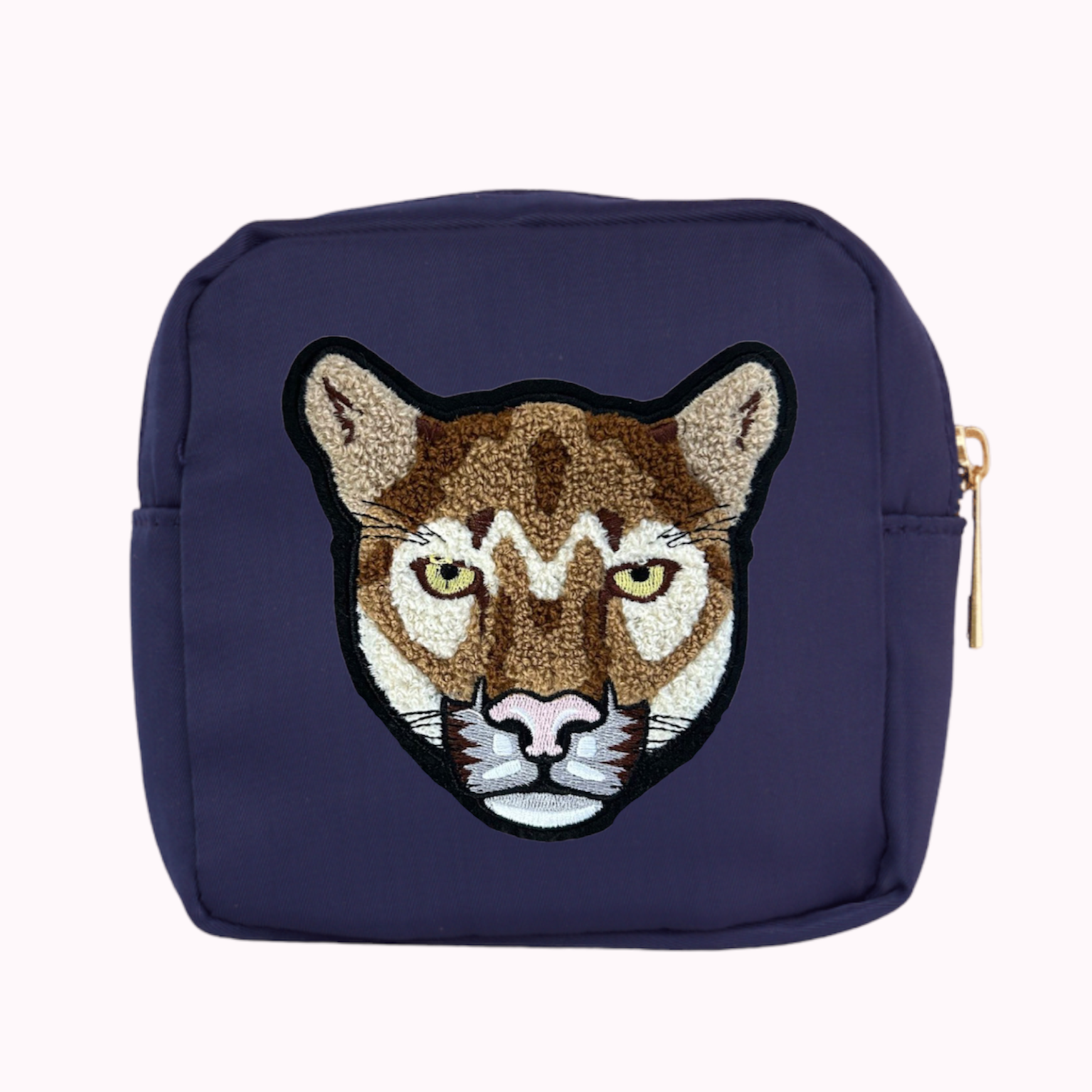 Navy mini crossbody bag with cougar patch. 