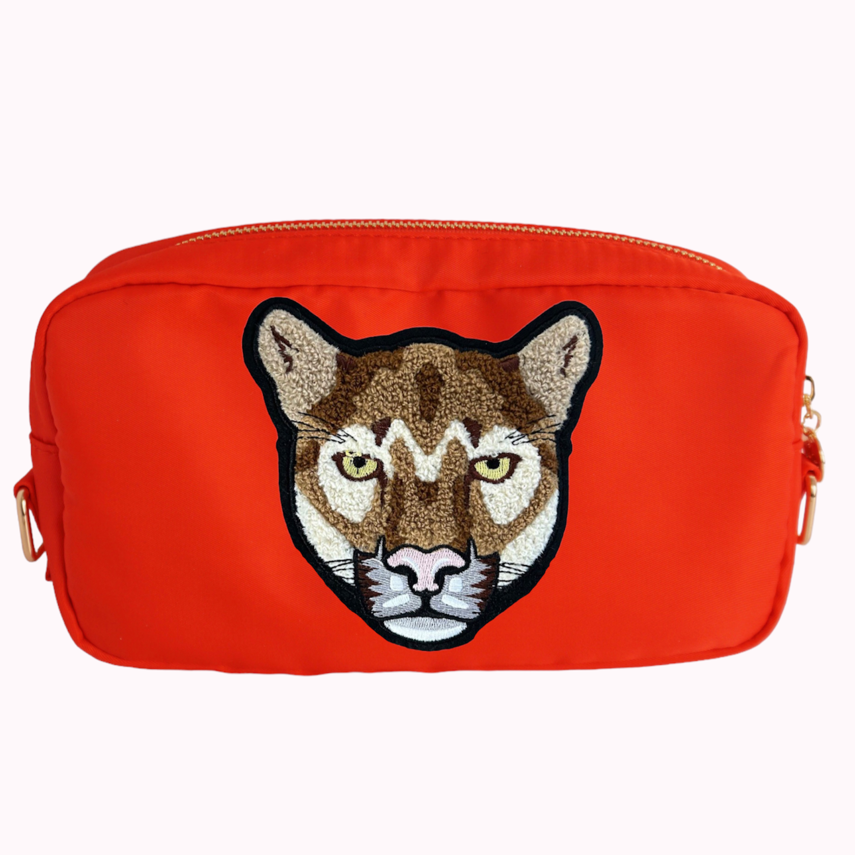 Bright red classic crossbody bag with cougar patch. 