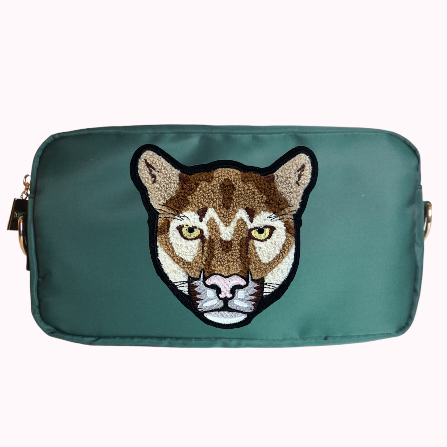 Green medium crossbody bag with cougar patch. 