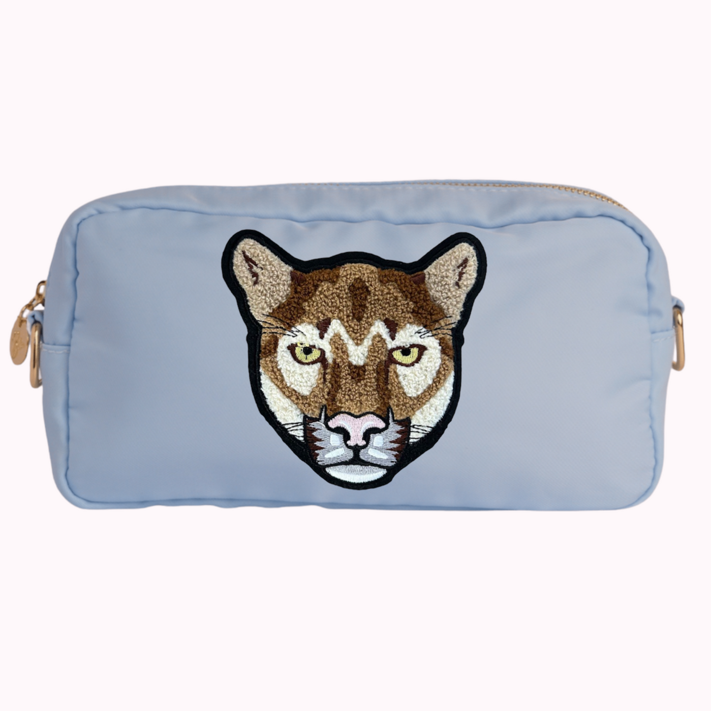 Light blue classic crossbody bag with cougar patch. 